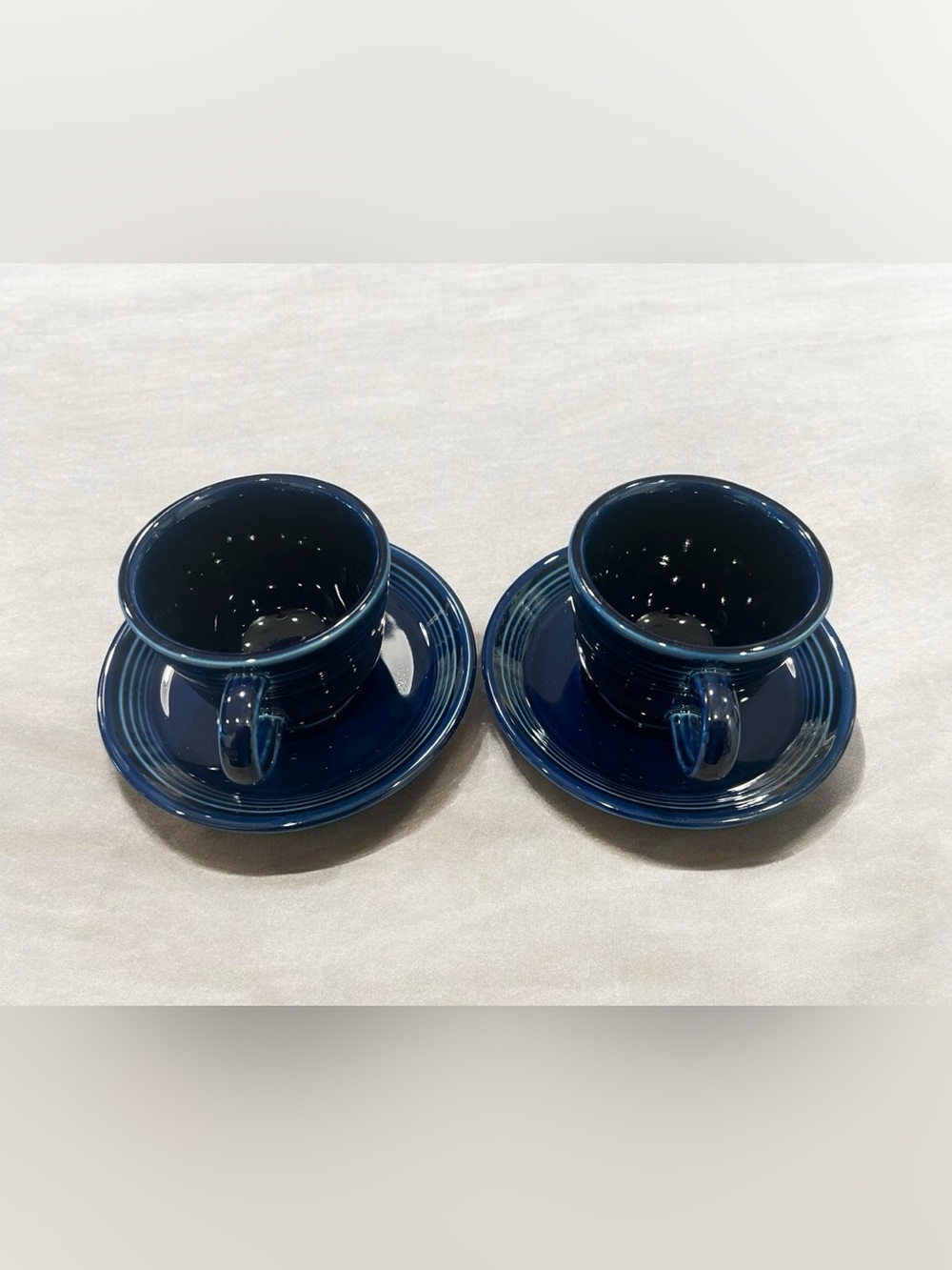 2 Homer Laughlin Fiestaware cobalt blue cups and saucers.